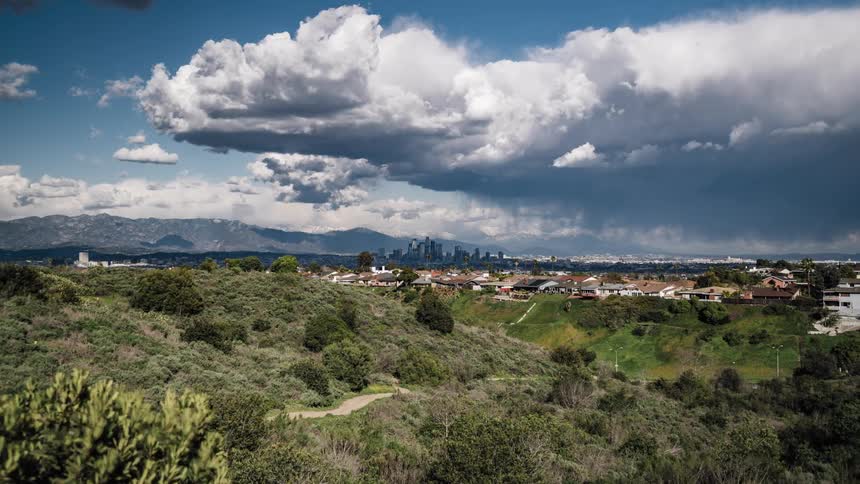 Heavy clouds are traveling from the mountains