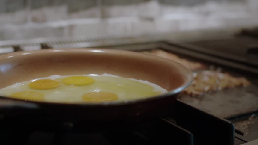 Eggs are cooked in a frying pan