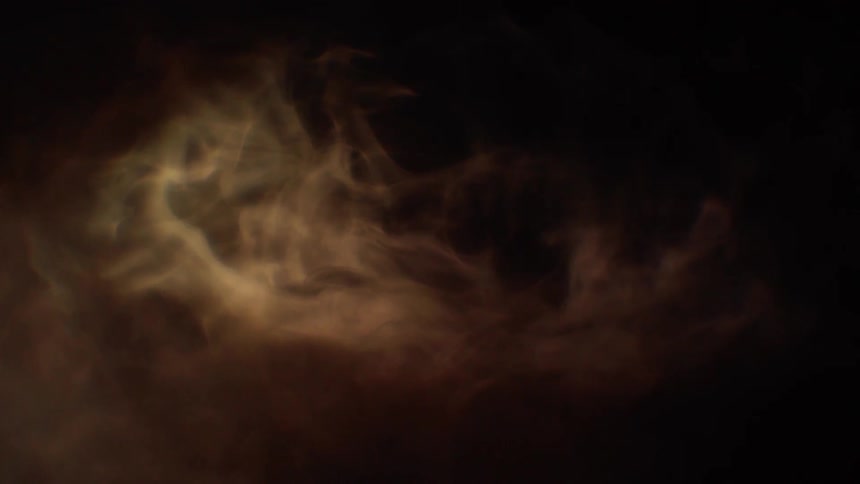 The dark room is filled with smoke