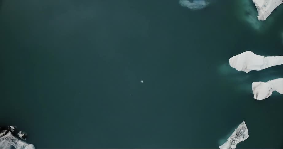 Large ice glaciers floating in cold ocean water