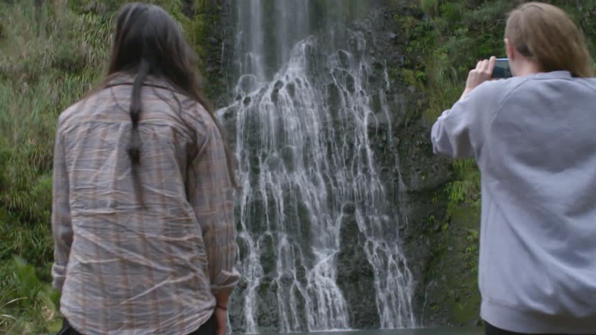 Two women find a waterfall