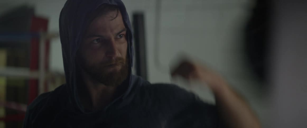 A man is punching a speedbag