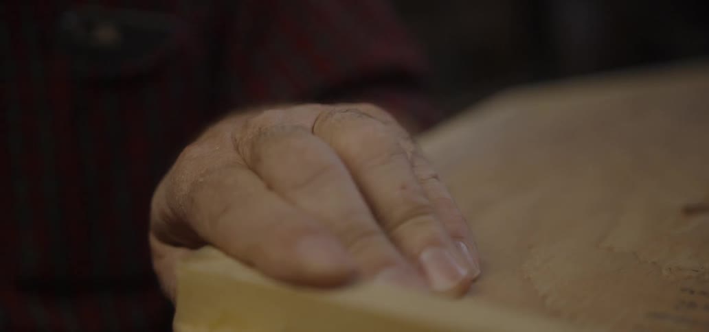 A man carves wood
