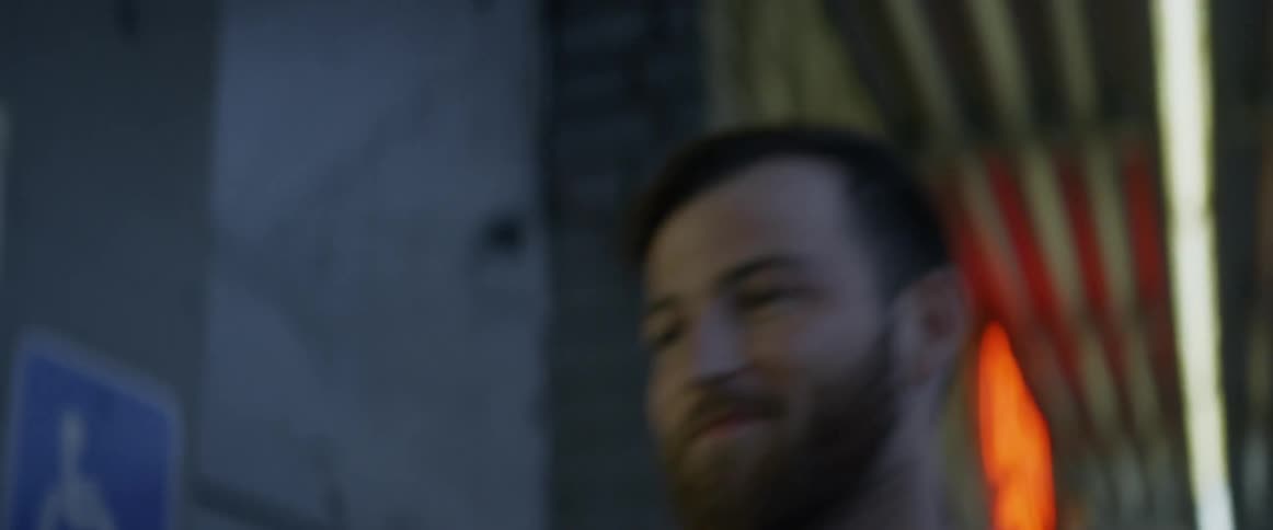A man walks and enters a store