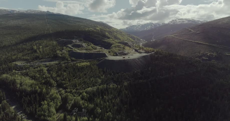 A quarry is operating in a remote location during the daytime