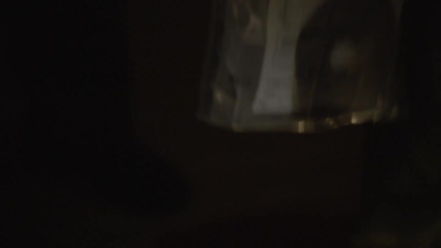 A person pens the dvd player and places the disc in a bag
