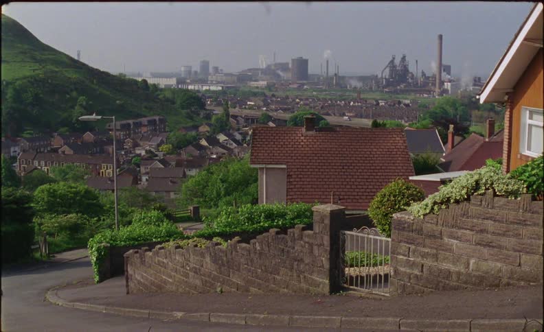 The homes line the steep road going down