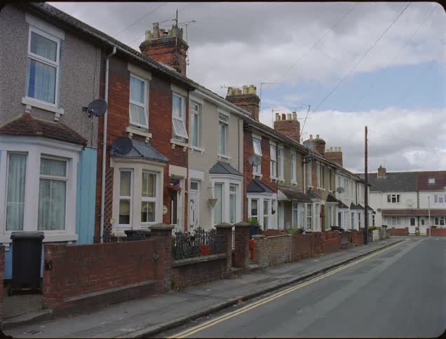 Colorful neighborhood town houses on cloudy day