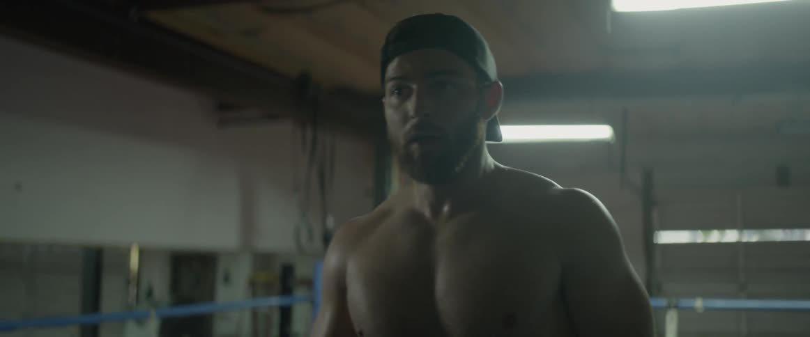 Two men box in a boxing ring