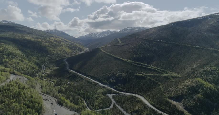 The hills have small trails running along the sides