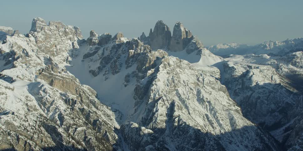 The snow covered mountain is vast