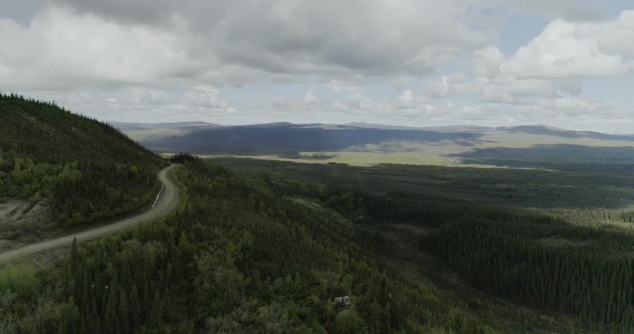 A small road runs along the top of the hill