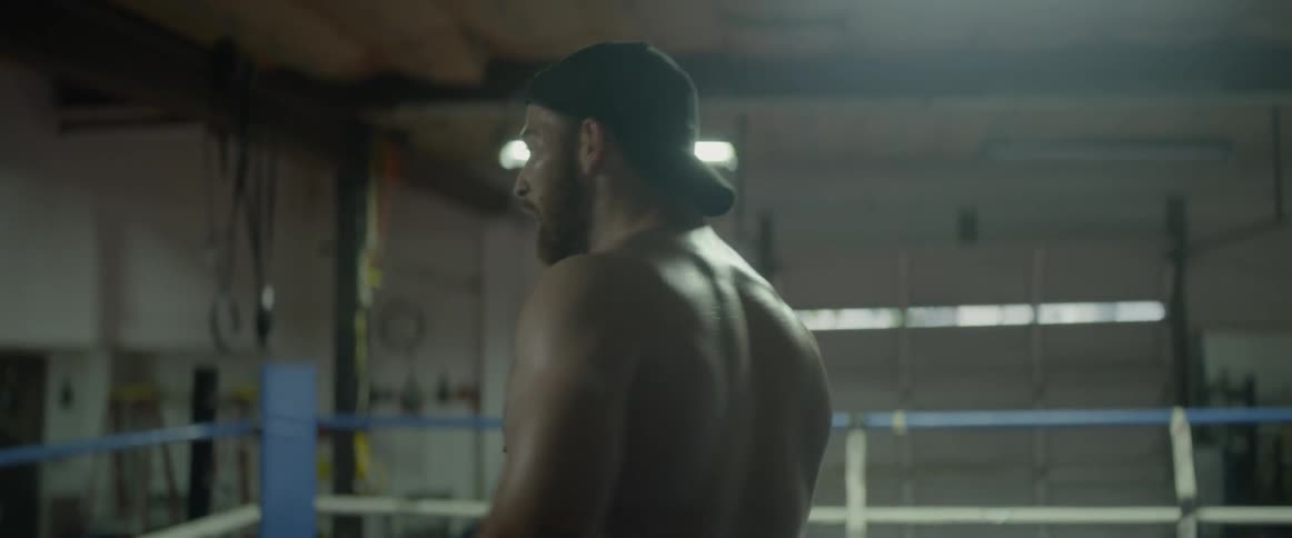 A boxer paces around the ring