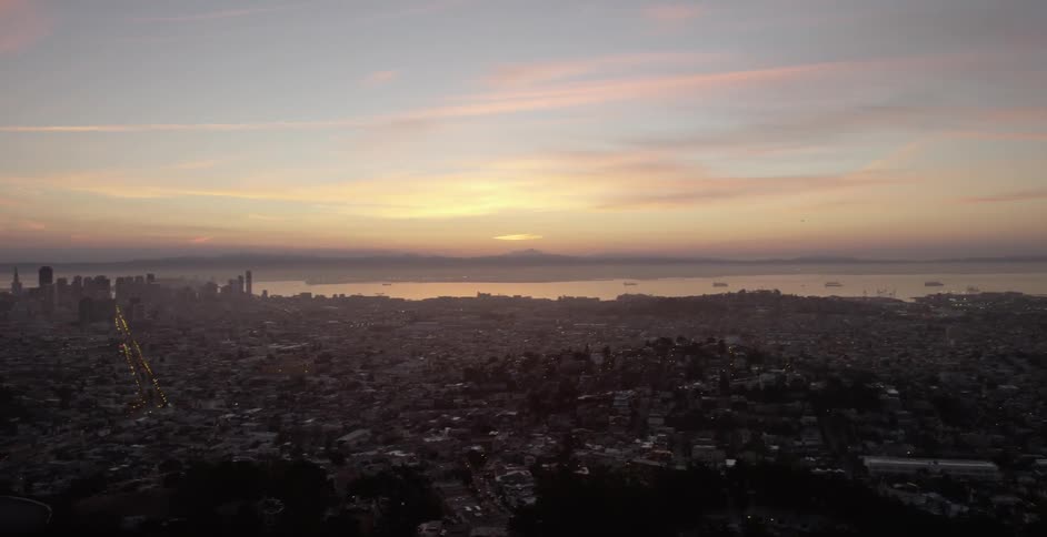 The sun sets over a city