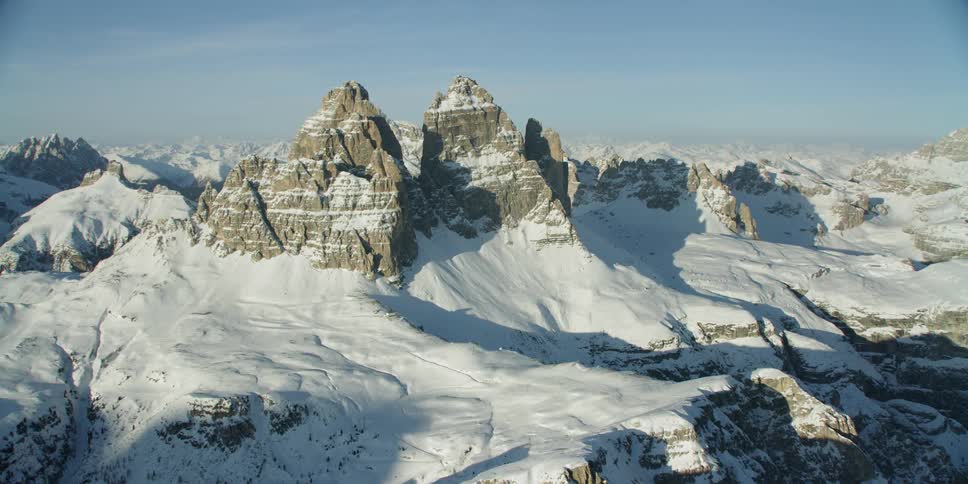 Snow covers rocky mountain peaks