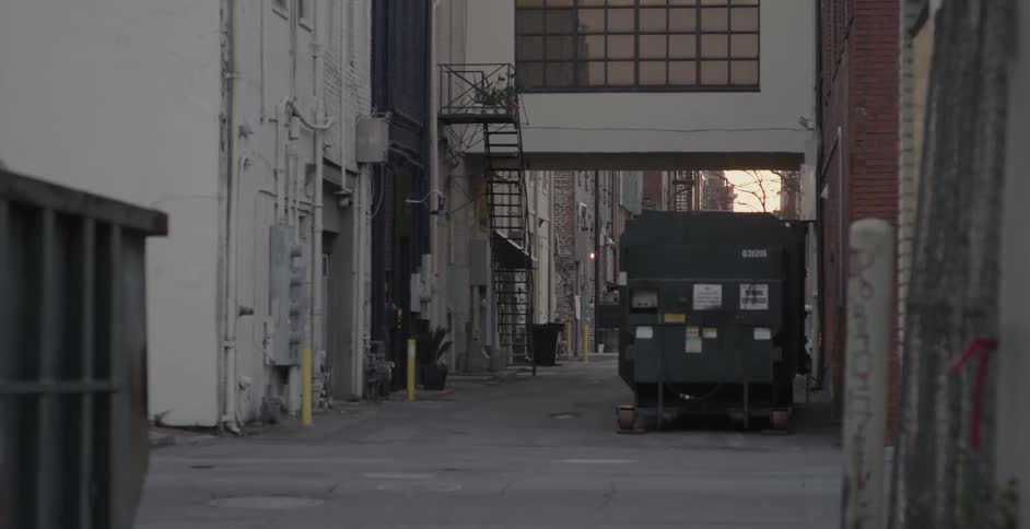 A bus drives down an alley
