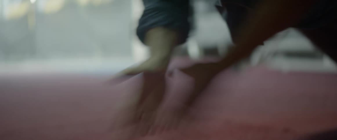 A man does push ups in a gym