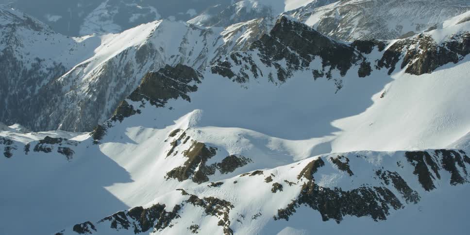 Snow covers mountains in the wilderness