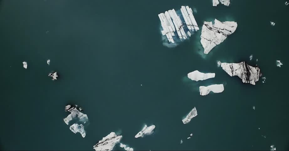 Ice glaciers floating in cold ocean waters