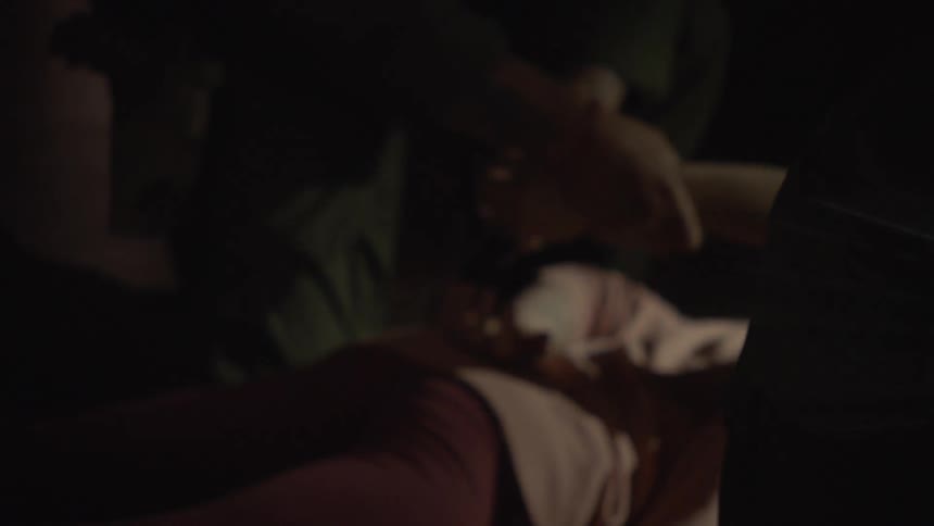 A man is arrested in the dark