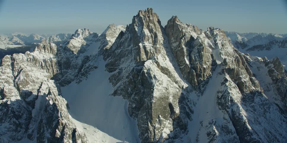 The tall mountain caps are covered with ice