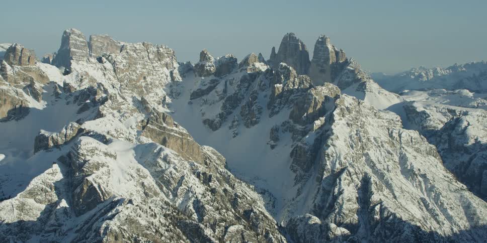 The tall mountains are covered with snow and ice