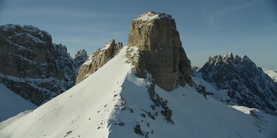 Heavy snow covers the mountain up to the tip