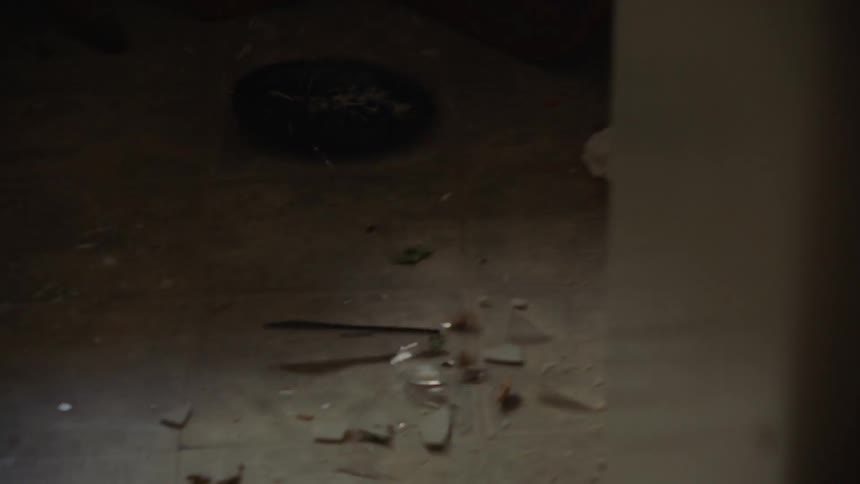 A swat team clear plates off of a table