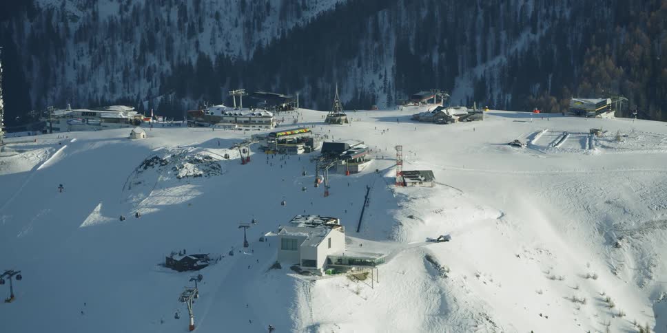 A ski resort sits on a mountain peak