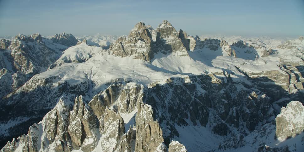 Snow covers rocky mountain peaks