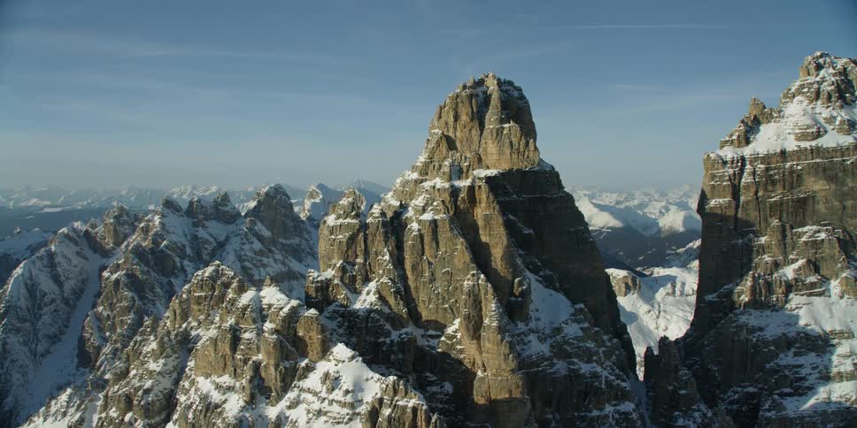 The sky is blue over the large mountain range