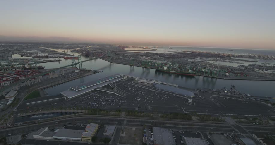 Aerial view of a harbor near a town at sunset