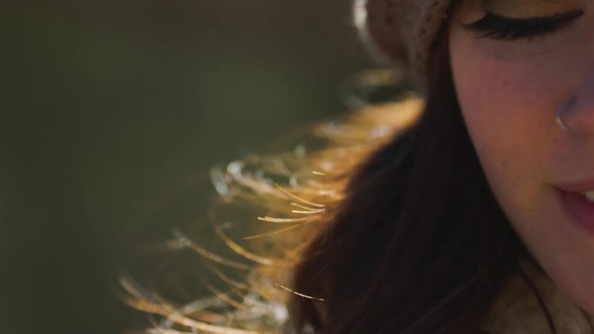 The wind blows a woman's hair