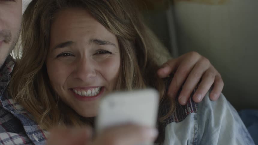 A woman is smiling with her boyfriend