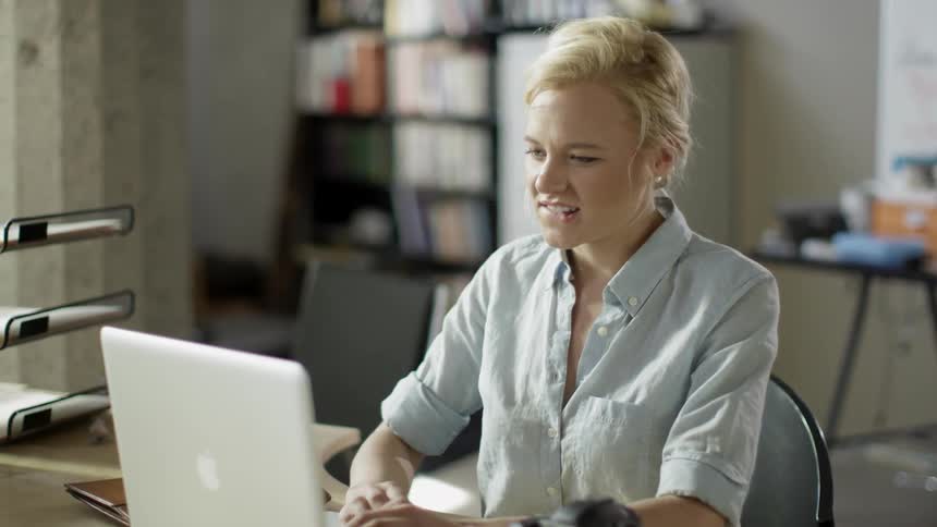 A woman is reading an email