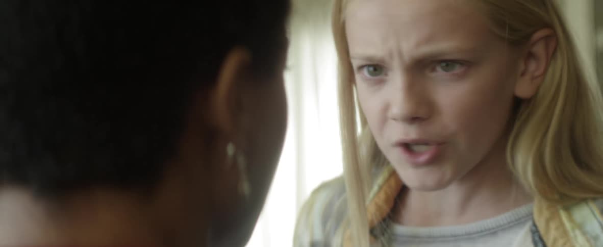 A girl shouts at a woman