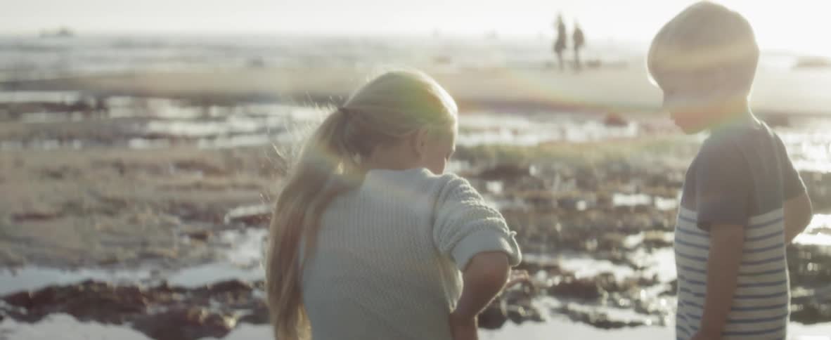 A child is sitting in the water