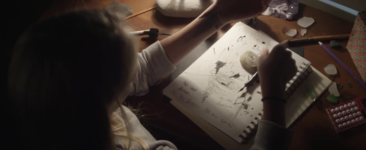 A woman draws on herself
