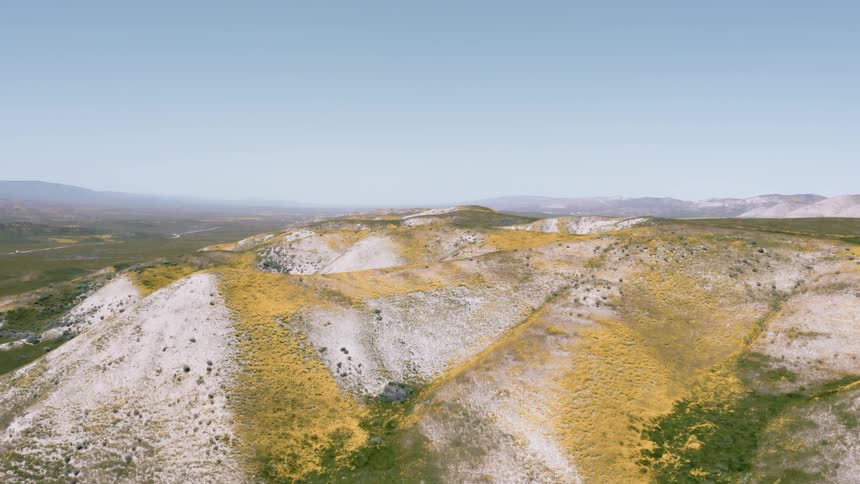 Snow dusted hills and ridges on a sunny day