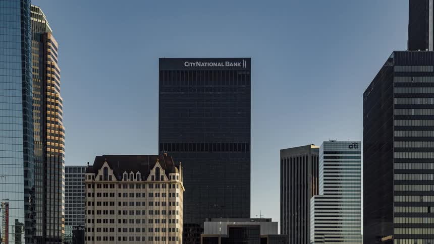 The sun is reflecting off the buildings on a sunny day