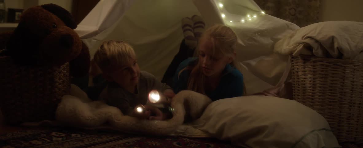 Children playing in a tent