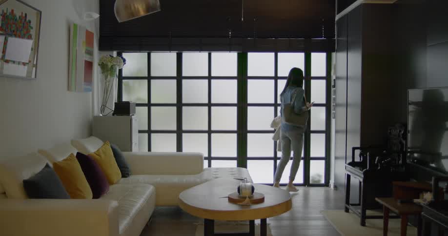 A woman runs and exits the house
