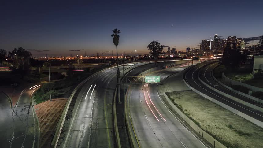Traffic flows on a busy highway through the night