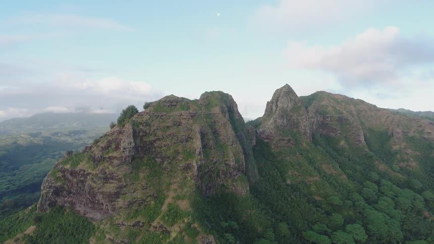 The tall mountains are covered with green