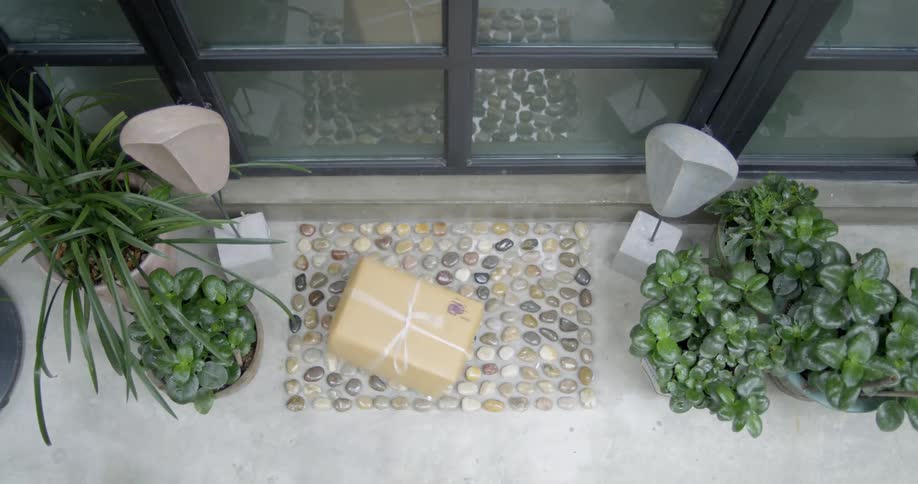 A package is tossed to the door mat
