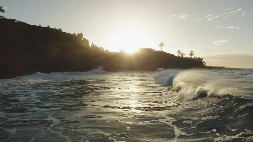 Ocean waves break and splash as they come to shore