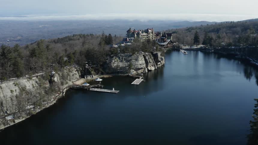 The lake leads to a building on the cliff