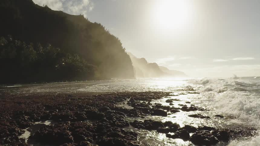 The sun is slowly rising above the shore