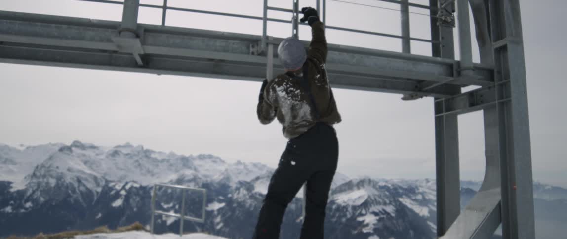 Person climbs up on a metal structure