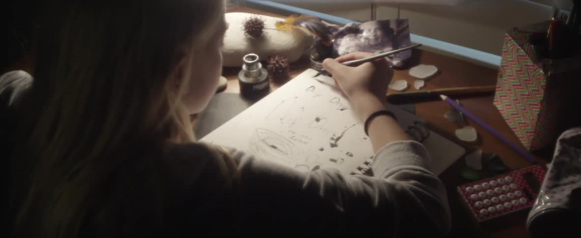 A girl is drawing a picture